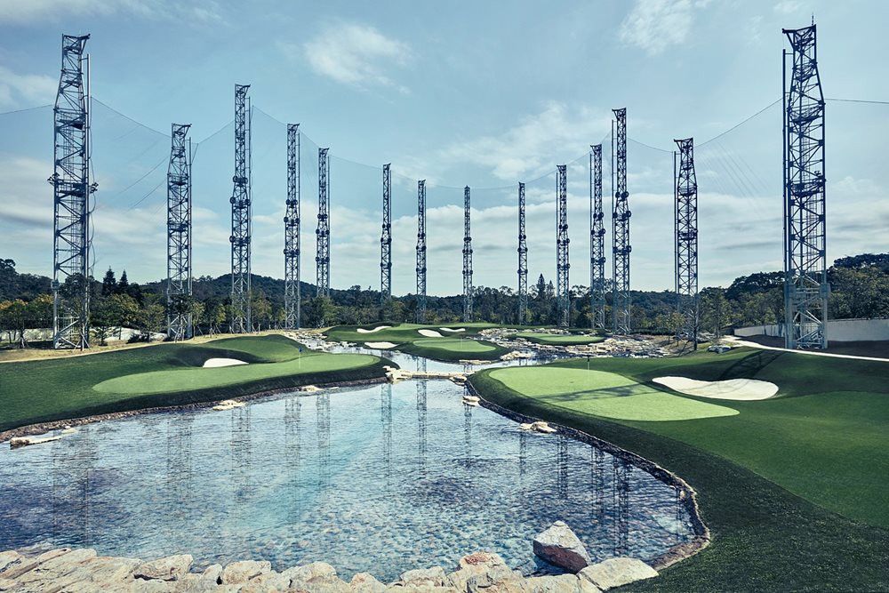 Greenwich Synthetic grass golf course with water and tall metal towers