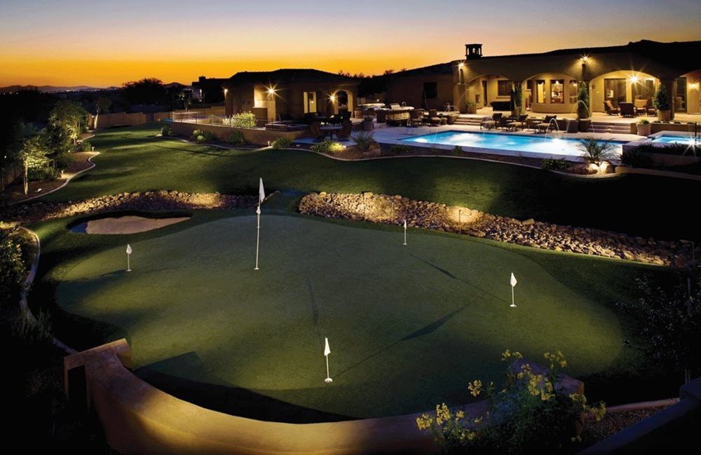 Greenwich residential backyard putting green grass
